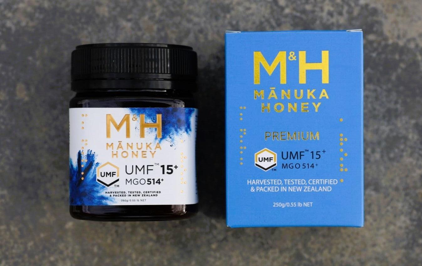 M&H Manuka Honey jar and box on a dark textured background