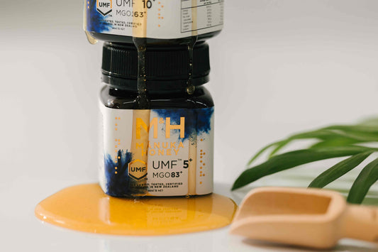 M&H Manuka Honey Jar with honey dripping down