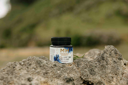 M&H Manuka Honey close-up of jar on rocks